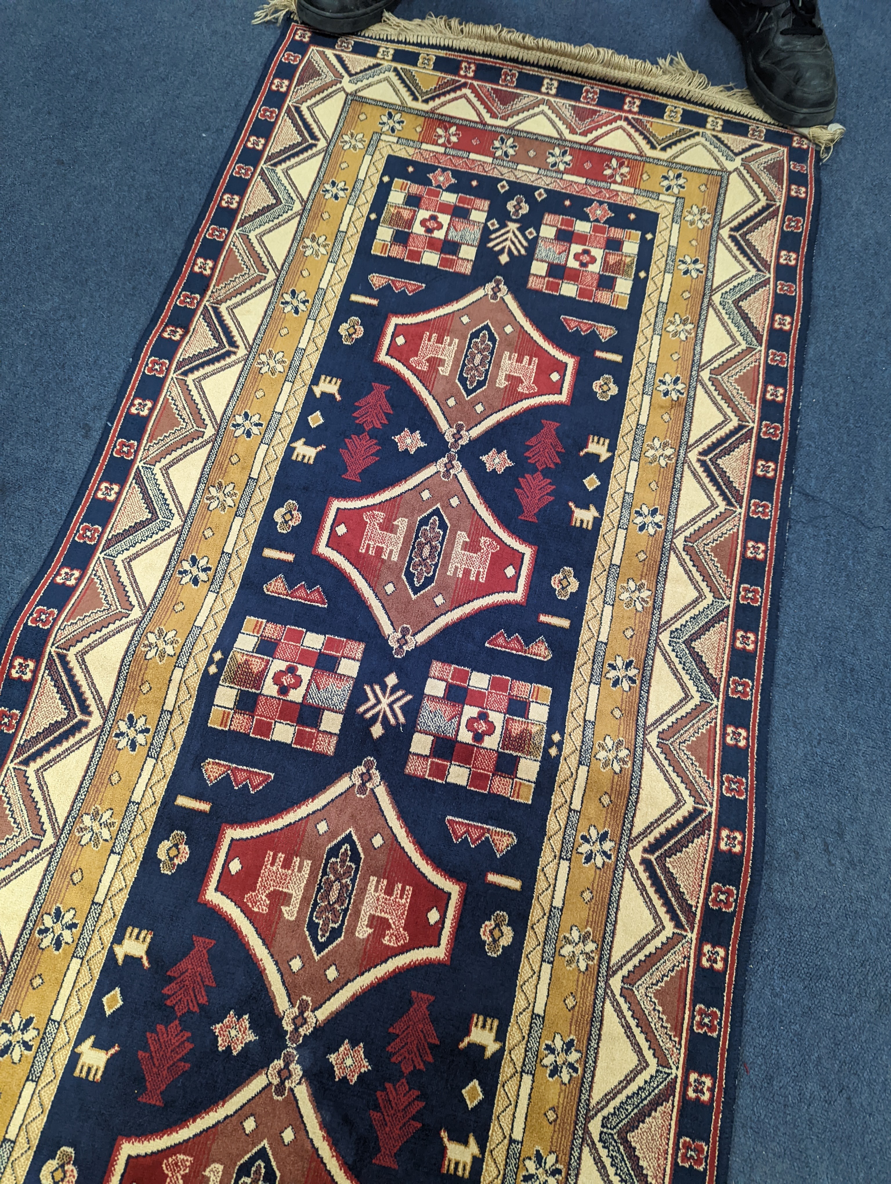 A small Caucasian style runner, 230 x 69cm